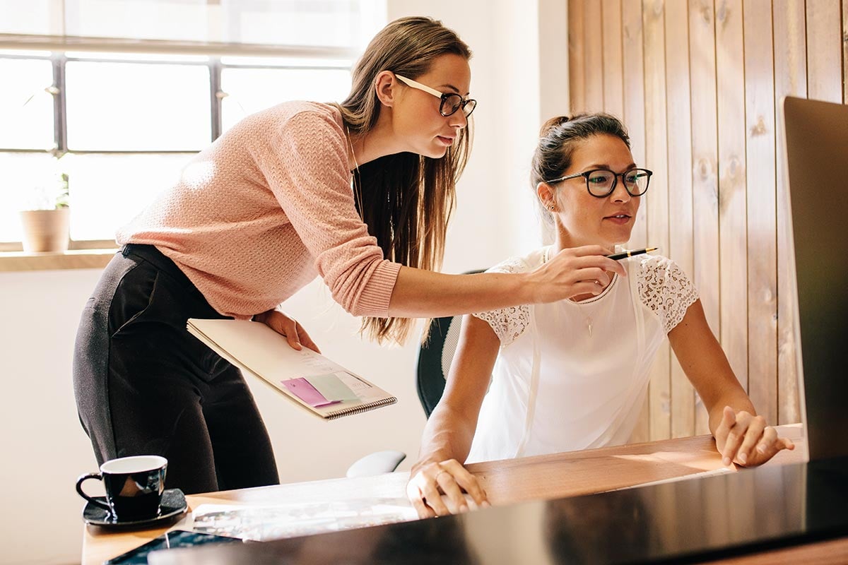 Two digital marketers collaborating on a project